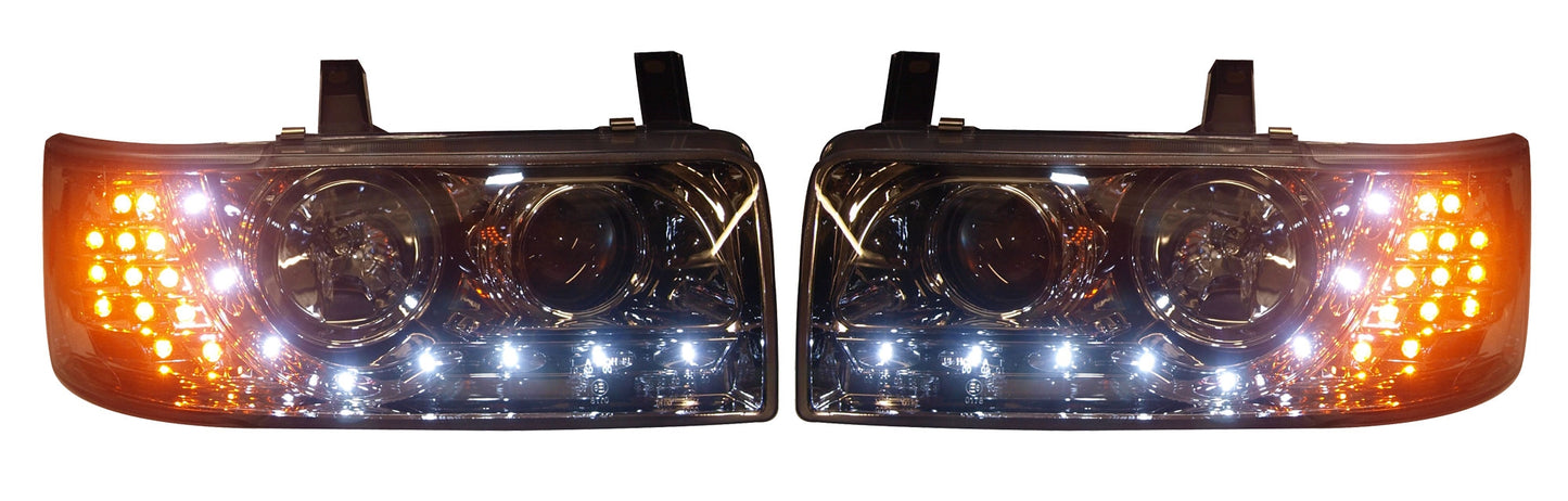 VW T4 Caravelle 1990-1997, T4 Transporter 1990-2003 (4-Cylinder Short Nose Models Only) Chrome DRL Headlights With LED Indicators.